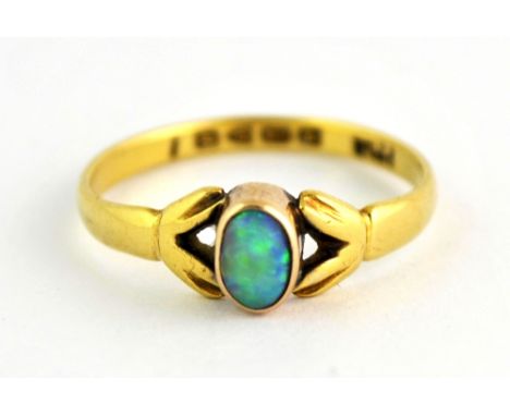 An 18ct yellow gold ring set with a solitaire opal (R).