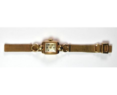 A ladies vintage 9ct gold cocktail watch on a 9ct metal core strap.
