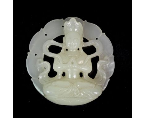 A very fine Chinese carved white jade amulet of a seated Tara, W. 5.5cm.