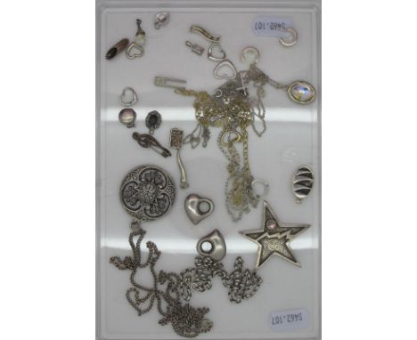 A Vintage Pendant, "Reims" of pierced textured design, on a chain; together with a Modernist style star pendant, of abstract 