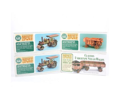 Four Bassett-Lowke white metal model kits, including a Burrell traction engine (x2), Ransomes farm combine, and Clayton Under