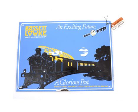 Original Bassett-Lowke enamel sign, formally from the factory in Kingswell Street, Northampton, 23cm by 31cm, 'An Exciting Fu