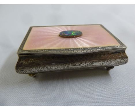 A continental white metal and enamel jewellery casket with hinged cover on four ball feet, A/F