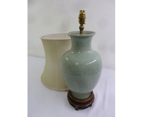 A Chinese celadon baluster form table lamp and shade