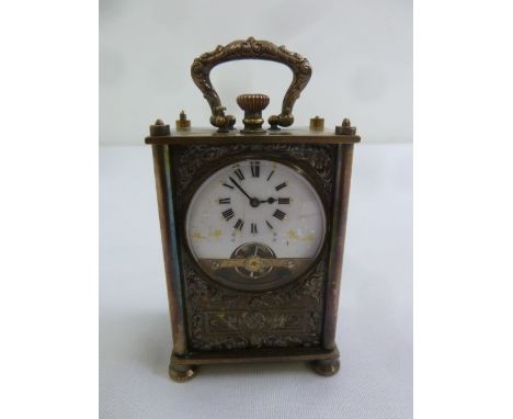 A Continental miniature silver plated carriage clock, enamel dial and Roman numerals, A/F
