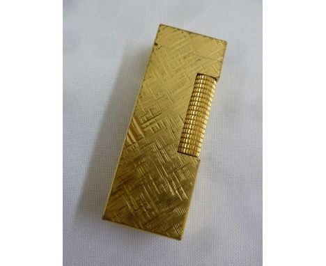 A Dunhill gold plated cigarette lighter