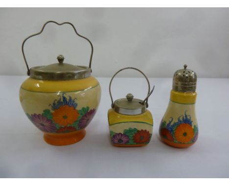 Clarice Cliff Bizarre biscuit barrel, jam jar and sugar sifter all with silver plated mounts