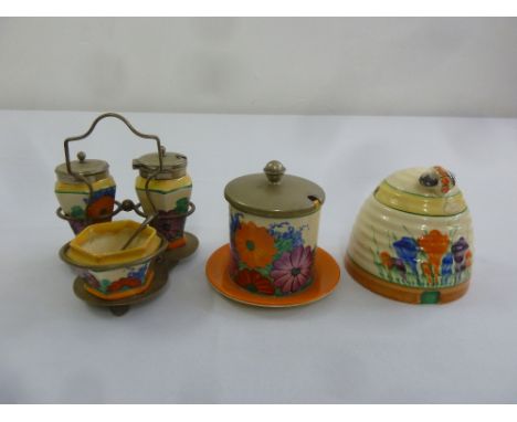 Clarice Cliff Bizarre condiment set, sugar bowl and a honey pot, A/F