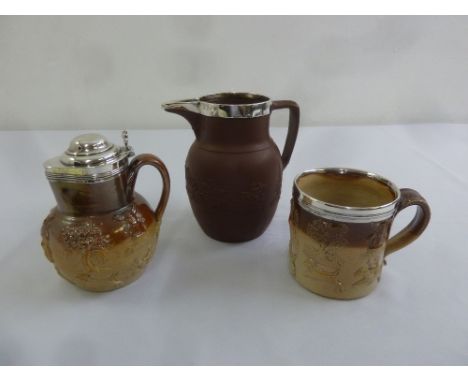 Two silver mounted stoneware jugs and a silver mounted mug all with hunting interest