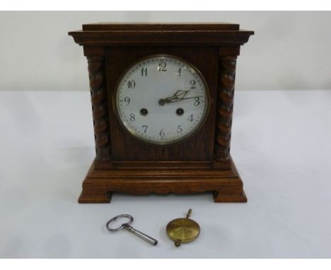 Oak cased mantle clock two train movement, to include key and pendulum