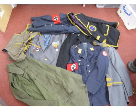Variety of Military and Police Jackets, some with medals, British Army poncho with broad arrow dated 1954. All have been subj