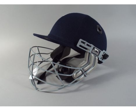 A Slazenger Pro Cricket Helmet.