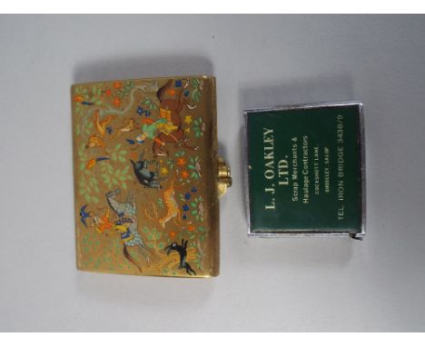 A Powder Compact with Persian Hunting Scene Decoration Together with Advertising Tape Measure for L J Oakley Limited Scrap Me