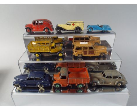 A Box Containing Eight Dinky Toys, Late 1940's - Early 1950's to Include Market Garden Lorry, 25 M Bedford Tipper, 25 H Fire 