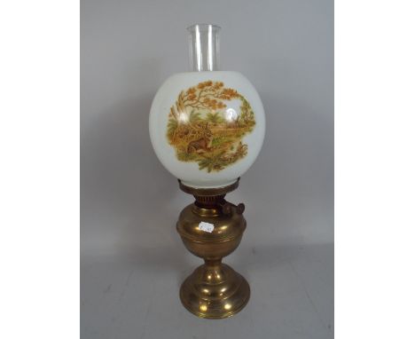 A Brass Oil Lamp with Opaque Shade Decorated with Rabbits.