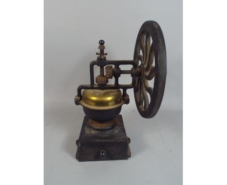 A Brass Mounted Iron Coffee Grinder.