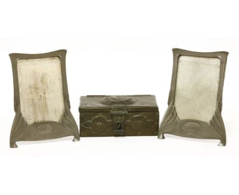 A pair of Art Nouveau pewter photograph frames,each with easel backs,15cm wide19.5cm high, anda copper-mounted casket,17cm wi