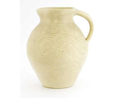 A Susie Cooper pottery jug,incised with a ram, inscribed 'Susie Cooper, England',21cm high