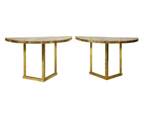 A pair of tubular brass console tables,1970s, each with six smoked glass panels to the tops, joining to become a single centr