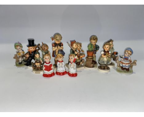 Thirteen Goebel Hummel porcelain figurines, including choir boys, the largest measures 15cm H