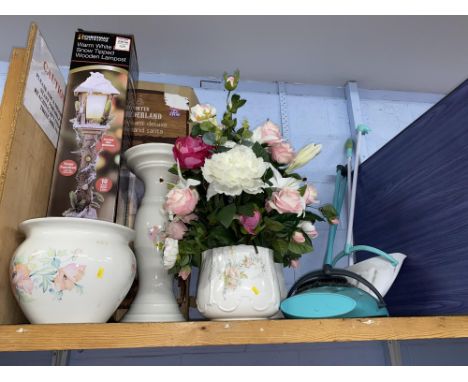 Shelf of assorted including planters and a table