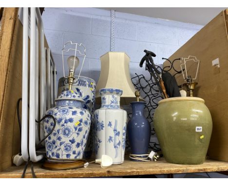 Shelf of lamps and sticks, various