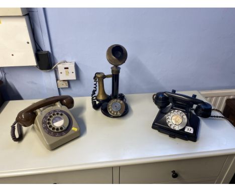Three early to mid 20th Century rotary dial telephones, to include a candlestick telephone and handset