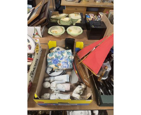 Box containing a model Yacht, Nao figures etc.
