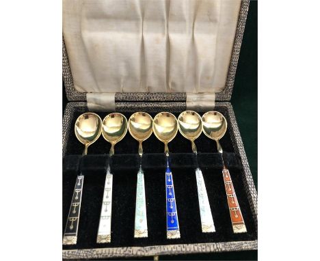 A boxed set of silver and enamel coffee spoons, made in Norway.