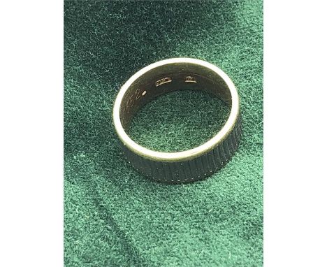 A gold ring marked 750