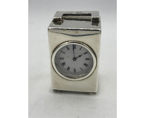 Early 20th century solid silver miniature clock and enamel white dial London hallmarked for Charlie and George Asprey CA.GA  