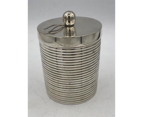 A small caddy, silver plated, ribbed with lid.
