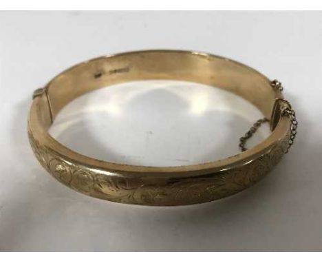 A 9ct gold bangle, with original receipt from Reids dated 1961