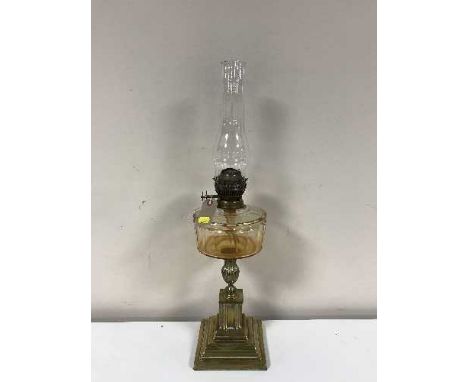 A Victorian glass and brass oil lamp with chimney 