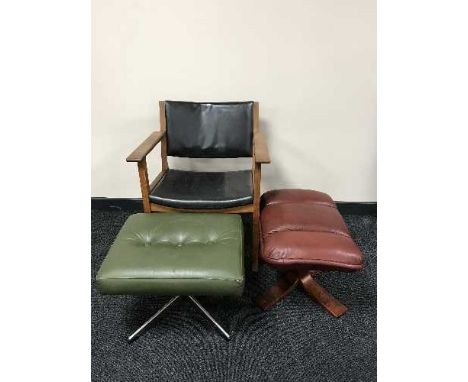 A mid 20th century teak armchair, button leather footstool and one further leather stool 