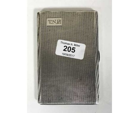 A silver cigarette case with engine turned decoration, initialled T N H