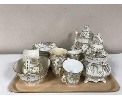 A tray of Victorian twenty-three piece cream and gilt tea service 