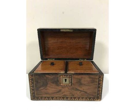 A Victorian inlaid walnut tea caddy 
