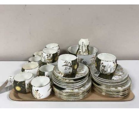 A tray of antique forty piece green and white tea service 