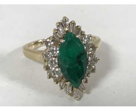 A 14ct gold cluster ring, the central marquise-cut emerald surrounded by brilliant and tapered-cut diamonds. Valued for insur