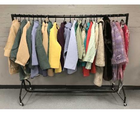 A rail of assorted lady's 1970's and later clothing - Wool capes with skirts, simulated fur coat, sheepskin coat, Estex two p