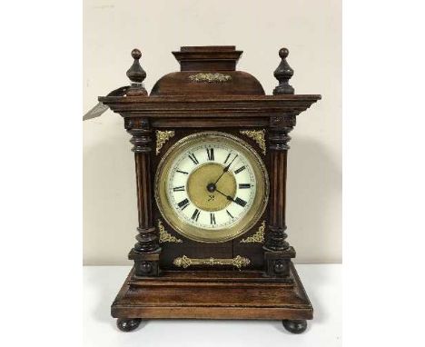 A late 19th century German mantel clock with enamelled dial 