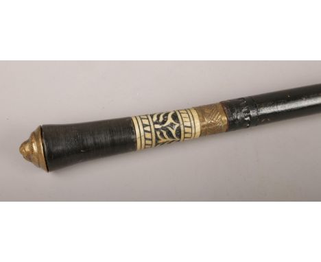 An ebonised sword stick, with brass lion mask pommel. (Length 92cm).  