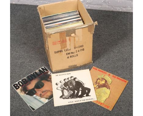 A box of vinyl records, Bob Marley &amp; The Wailers, Madness, Bob Dylan, Queen, Madness, Meaf loaf etc.  In good condition.