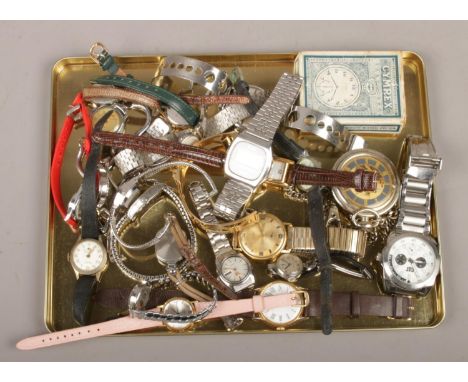 A tin of assorted watches including Cymrex pocket watch in original box, ladies and gents wrist watches, bracelet watches and