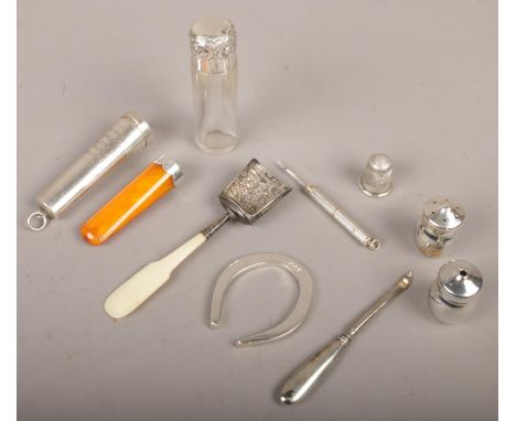 A quantity of silver to include silver rimmed cheroot holder in silver case, miniature silver horse shoe, tooth pick, etc.  