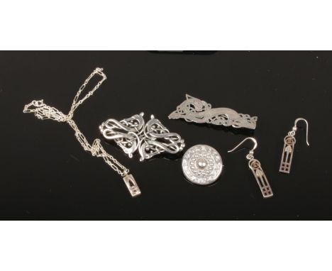 Five pieces of Scottish silver jewellery including Ola Marie Gorie entwined beasts brooch, other Celtic pieces and Mackintosh