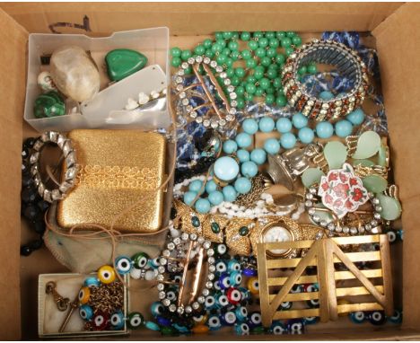 A box of costume jewellery and collectables including beads, gilt compact, expanding bracelet, hardstone eggs and paste buckl