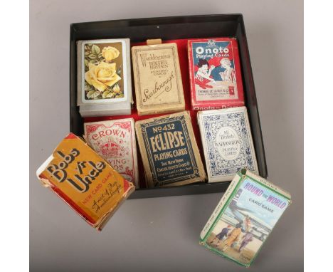 A collection of playing cards, Waddingtons Beautiful Britain Scarborough, Bobs yr Uncle &amp; Round the World card game examp