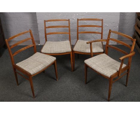Four retro teak ladder back dining chairs, possibly G Plan, including a carver armchair.  